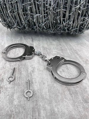 Настоящие стальные наручники для полиции 15206 фото